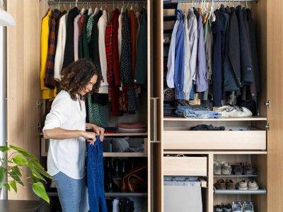 woman organizing closet Getty